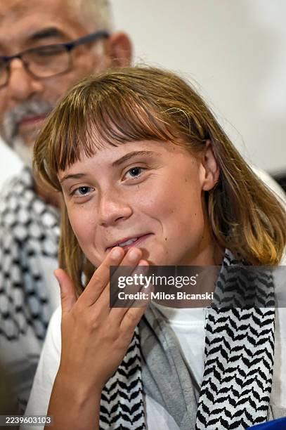 Swedish activist Greta Thunberg speaks as she arrives at Eleftherios Venizelos International Airport on October 6, 2025 in Athens, Greece. Around 450...