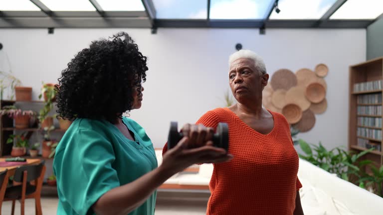 https://media.gettyimages.com/id/2239633816/video/senior-patient-woman-doing-workout-with-nurse-at-home.jpg?b=1&s=640x640&k=20&c=_-OBCXy3CAf0GF3HNqzjoiAU3qGcq8DKYRVt2erqDlU=