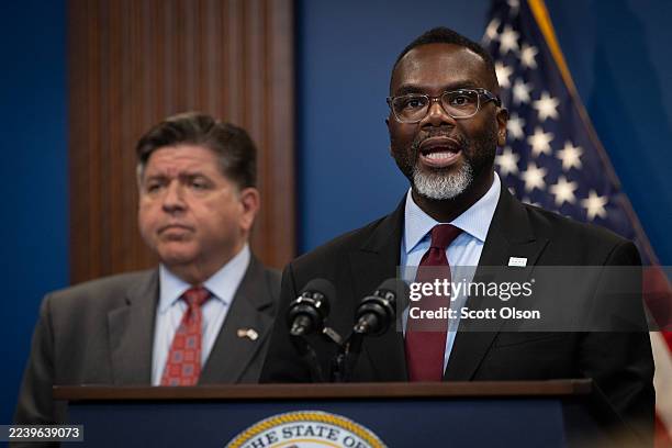 Illinois Gov. JB Pritzker listens as Chicago Mayor Brandon Johnson speaks at a news conference on October 06, 2025 in Chicago, Illinois. Pritzker,...