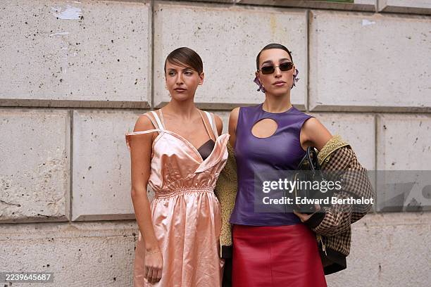 Guest wears long straight light brown hair pulled into a low ponytail with a deep side part and a pale pink fabric flower hair clip, a brown fur...