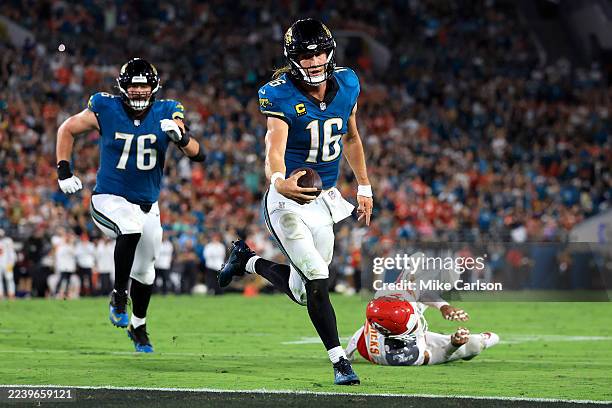 Trevor Lawrence of the Jacksonville Jaguars scores a touchdown against the Kansas City Chiefs during the third quarter at EverBank Stadium on October...