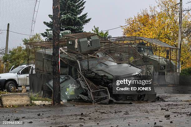 Ukrainian armoured personnel carrier, damaged during a Russian FPV drone strike, lies at a roadside near Druzhkivka, in the Donetsk Oblast, in...