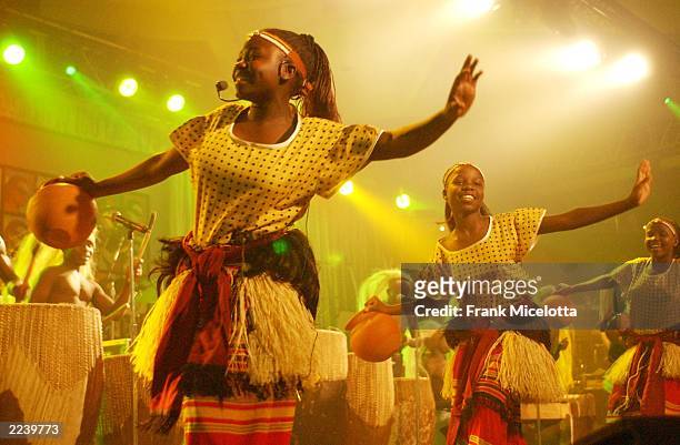 Children of Uganda perform on stage during the13th Annual MusiCares Person Of The Year tribute at the Marriott Marquis February 21, 2003 in New York...