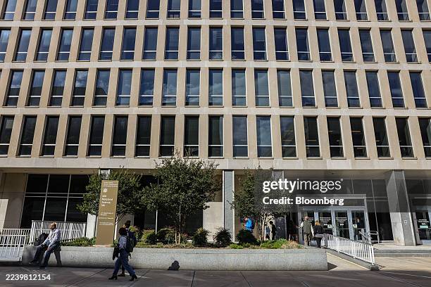 Commuters outside the Department of Education in Washington, DC, US, on Friday, Oct. 10, 2025. The White House is making good on threats to fire...
