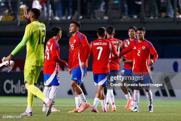 Fabian Hormazabal of Chile and teammates celebrate their victory following the International Friendly match between Chile and Peru at Bicentenario de...