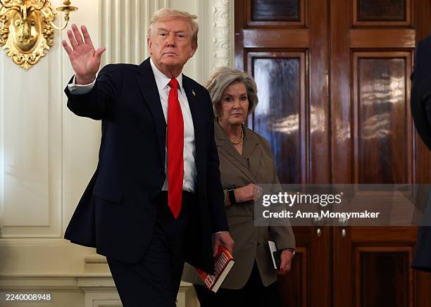 President Donald Trump departs with White House Chief of Staff Susie Wiles following a roundtable discussion in the State Dining Room of the White...
