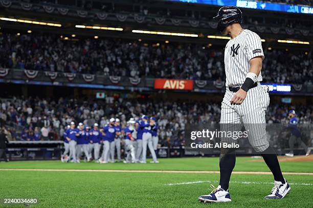Aaron Judge of the New York Yankees walks off the field after the Toronto Blue Jays defeated the Yankees in game four of the American League Division...