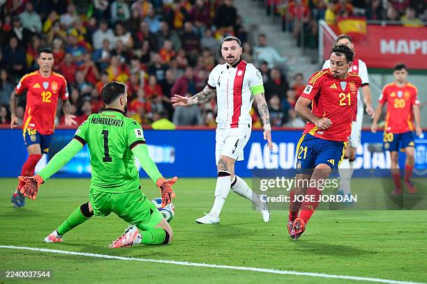 Georgia's goalkeeper Giorgi Mamardashvili blocks a shot by Spain's forward Mikel Oyarzabal during the 2026 World Cup qualifier Europe zone group E...