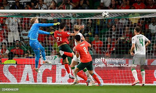 Portugal , Portugal - 11 October 2025; Rúben Neves of Portugal scores his side's first goal past Republic of Ireland goalkeeper Caoimhin Kelleher...