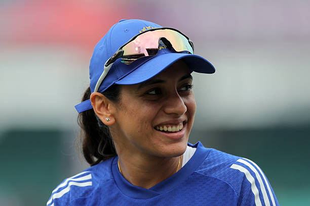 Smriti Mandhana of India looks on during the warm up prior to the ICC Women's Cricket World Cup India 2025 match between India and South Africa at...
