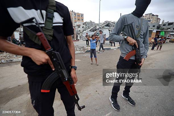 Members of the internal security forces loyal to the Palestinian group Hamas, man a checkpoint in the Nuseirat refugee camp in the central Gaza...