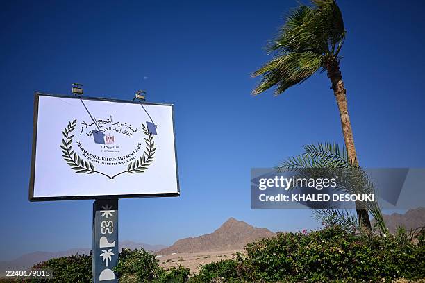 Sign announces the upcoming the US-brokered international Gaza peace summit, in the Egyptian Red Sea resort town of Sharm el-Sheikh on October 12,...