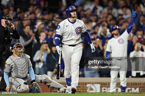 Ian Happ of the Chicago Cubs hits a home run during the first inning against the Milwaukee Brewers in game four of the National League Division...