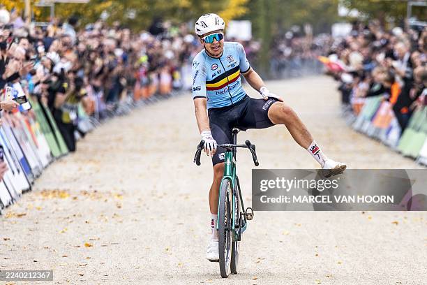 Belgium's Florian Vermeersch celebrates winning the men's elite race cycling event as part of the UCI Gravel World Championships in Maastricht, on...