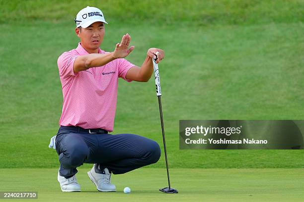 Michael Kim of the United States lines up a putt on the 18th green during the second round of the Baycurrent Classic Presented by LEXUS at Yokohama...