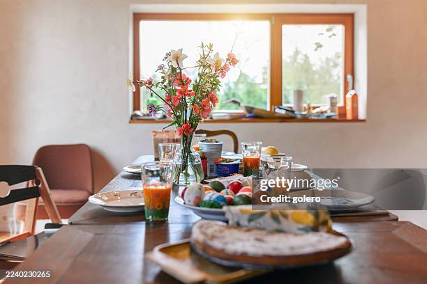 prepared easter table in living room - easter breakfast stock pictures, royalty-free photos & images