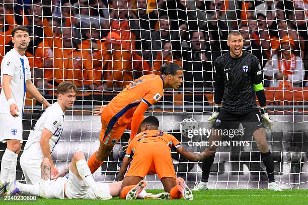 Finland's goalkeeper Jesse Joronen reacts after Netherlands' defender Virgil van Dijk scored his team's second goal during the FIFA World Cup 2026...