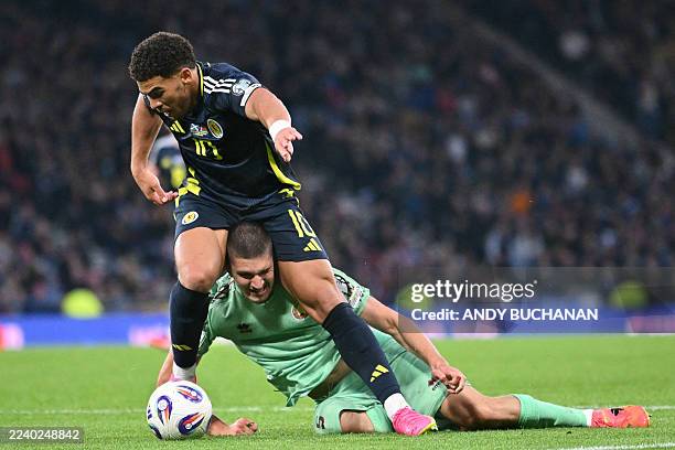 Scotland's striker Che Adams vies with Belarus' defender Yegor Parkhomenko during the 2026 World Cup Group C qualifier football match between...