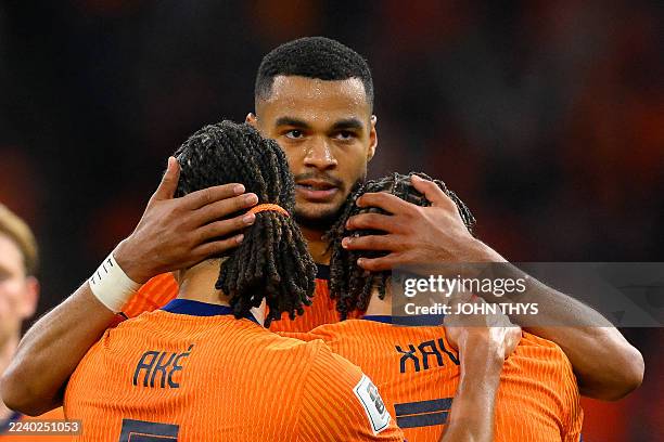 Netherlands' forward Cody Gakpo celebrates with teammates after scoring his team's fourth goalduring the FIFA World Cup 2026 Group G qualification...