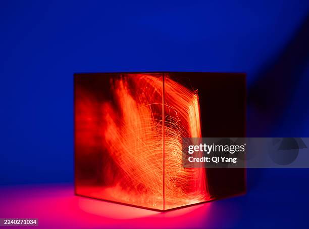 long exposure of a glass cube and optical fibers. artificial intelligence and data. technology concept - perspex cube stock pictures, royalty-free photos & images