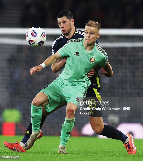 Belarus' Evgeni Malashevich and Scotland's Scott McKenna in action during a 2026 FIFA World Cup Qualifying match between Scotland and Belarus at...