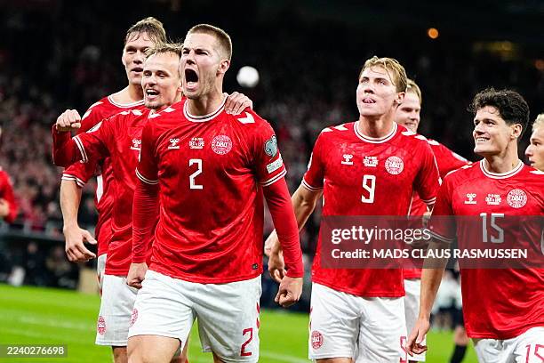 Denmark's defender Joachim Andersen celebrates with teammates scoring his team's second goal during the 2026 World Cup qualifiers Europe zone group G...