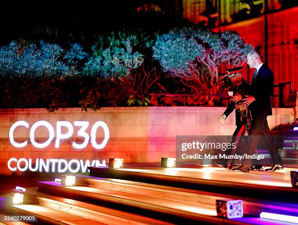 Prince William, Prince of Wales, accompanied by Lord-Lieutenant of Greater London Sir Ken Olisa, departs after attending the Countdown to COP30 event...