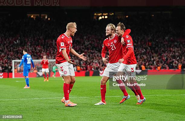Mikkel Damsgaard of Denmark scores and celebrates his teams third goal during the UEFA World Cup qualification match between Denmark and Greece at...