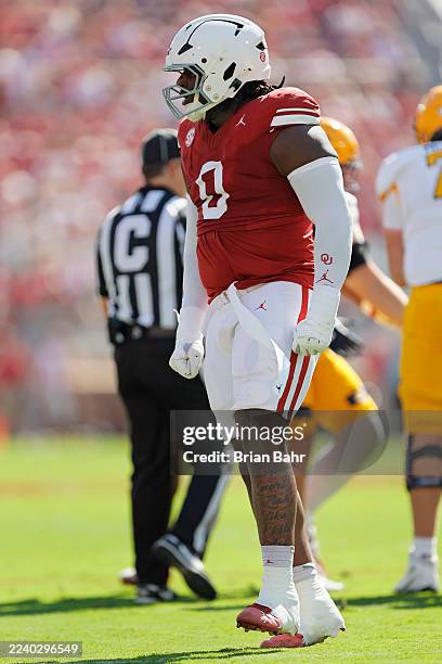 Defensive lineman David Stone of the Oklahoma Sooners celebrates after sacking quarterback Devin Kargman of the Kent State Golden Flashes for a loss...