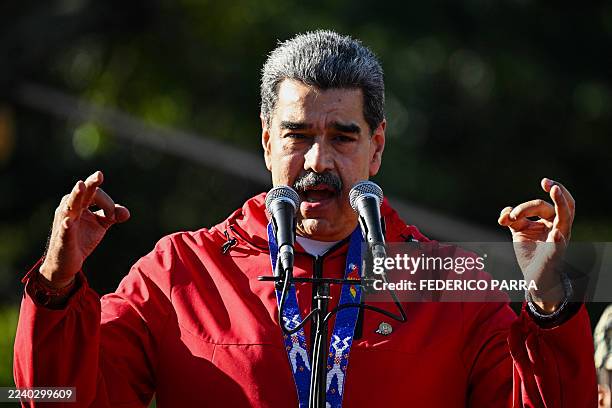 Venezuela's President Nicolas Maduro speaks during a march to commemorate the "Day of Indigenous Resistance" in Caracas on October 12, 2025. On...