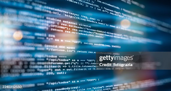 Computer Screen With Programming Code And Blurred Lights Computer Screen With Programming Code And Blurred Lights