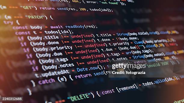 programming code on computer screen with colorful syntax highlighting - langage informatique photos et images de collection