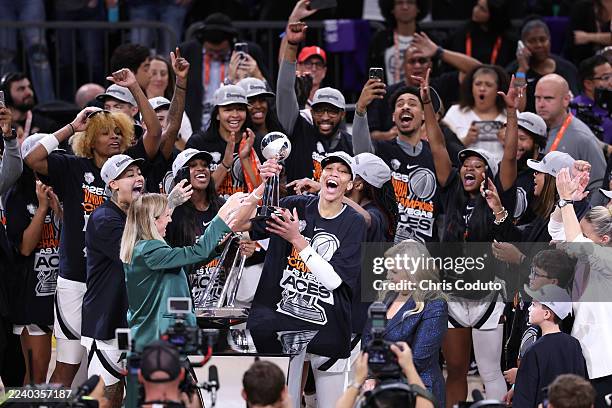 Ja Wilson of the Las Vegas Aces celebrates with the Most Valuable Player award after winning Game Four of the 2025 WNBA Playoffs finals at Mortgage...