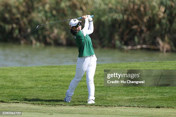 Yuri Yoshida of Japan plays her shot on the 4th hole during the third round of the Buick LPGA Shanghai 2025 at Shanghai Qizhong Garden Golf Club on...