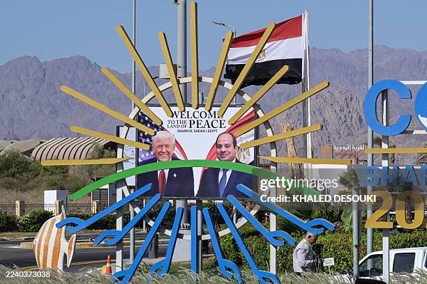 This photograph shows a billboard bearing the portraits of US President Donald Trump and Egyptian President Abdel Fattah al-Sisi outside the congress...