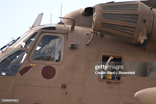 Gaza hostage Ziv Berman celebrates from a helicopter as he arrives at Chaim Sheba Medical Center at Tel HaShomer on October 13, 2025 in Ramat Gan,...