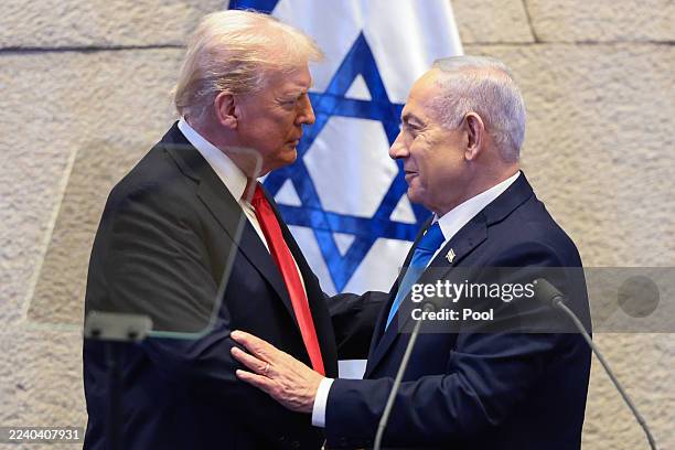 President Donald Trump speaks with Israeli Prime Minister Benjamin Netanyahu at the Knesset, Israel's parliament, on October 13, 2025 in Jerusalem....