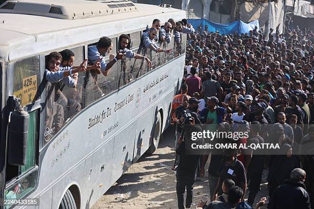 People gather to welcome Palestinians released from Israeli prisons under a Gaza ceasefire and hostage exchange deal with Palestinian factions, as...