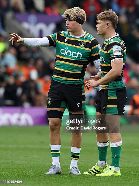 Henry Pollock of Northampton Saints talks to team mate Fin Smith during the Gallagher PREM match between Northampton Saints and Leicester Tigers at...