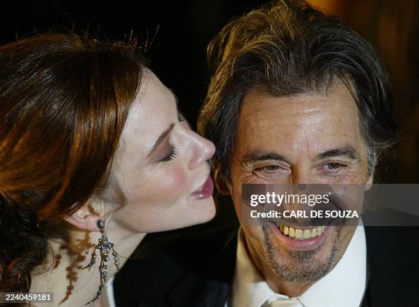 Actress Lynn Collins kisses co-star US actor Al Pacino before the