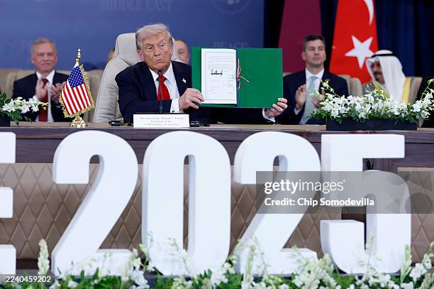 President Donald Trump signs a Gaza ceasefire agreement on October 13, 2025 in Sharm El-Sheikh, Egypt. President Trump is in Egypt to meet with...