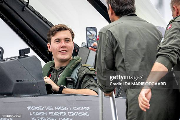 Crown Prince Christian of Denmark sits aboard an F-16 fighter jet after a flight at Skrydstrup Barracks, Denmark, on October 13, 2025. The flight is...