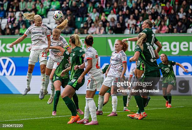 Pernille Harder of Bayern Muenchen jumps for a header during the Google Pixel Women's Bundesliga match between VfL Wolfsburg Women's and FC Bayern...