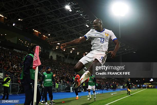 France's forward Jean-Philippe Mateta celebrates scoring his team's second goal with teammates during the 2026 World Cup qualifying round Group D...