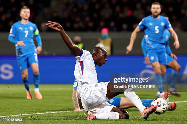 France's forward Jean-Philippe Mateta scores his team's second goal during the 2026 World Cup qualifying round Group D football match between Iceland...
