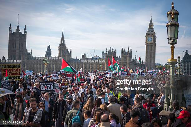 Demonstrators take part in a national demonstration for Palestine in Central London on October 11, 2025 in London, England Israel began withdrawing...