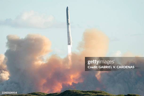 SpaceX's Starship rocket 38 launches during the 11th test flight on October 13, 2025 as seen from South Padre Island in Texas. SpaceX's massive...