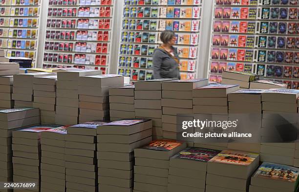 October 2025, Hesse, Frankfurt/Main: Paperbacks are stacked at the DTV Verlag stand at the Frankfurt Book Fair during set-up. The world's largest...