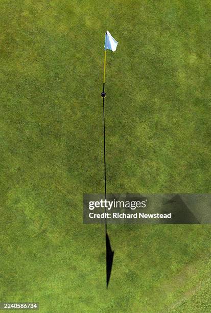 golf flag shadow - golf flag stock pictures, royalty-free photos & images