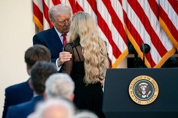 President Donald Trump, left, and Erika Kirk, chief executive officer of Turning Point USA, during a Medal of Freedom ceremony for Turning Point USA...